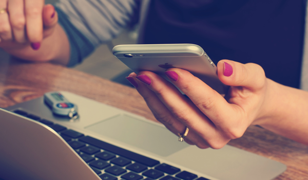 a hand holding a smartphone